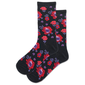A pair of black crew socks with a red and purple poppy floral pattern.