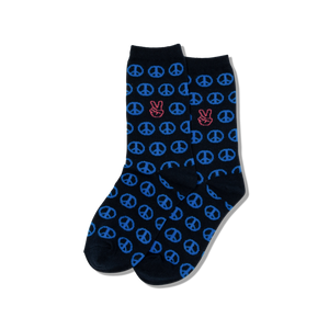 Person wearing blue patterned peace sign socks on a white floor.