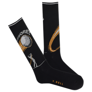 A pair of K.Bell men's active golf crew socks in black with a gold and green design, featuring a golf ball and tees and the phrase 'Fooore!"