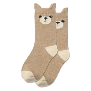 Child sitting in a hammock wearing socks with bear faces.