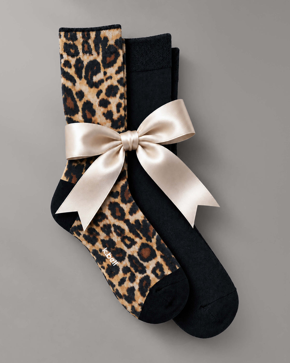 K.Bell two-pack socks wrapped with a satin bow.