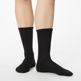Woman wearing black Dr. Scholl's crew socks thumbnail