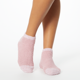 Person wearing pink two-toned tonal fuzzy Dr. Scholl's soothing spa socks. thumbnail