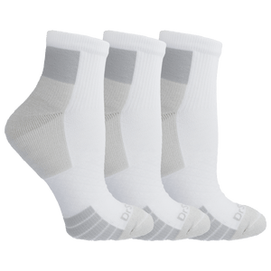 Three pairs of white socks on a black background