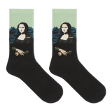 A pair of black crew socks featuring a printed graphic of the Mona Lisa with a light green background and blue mountains.