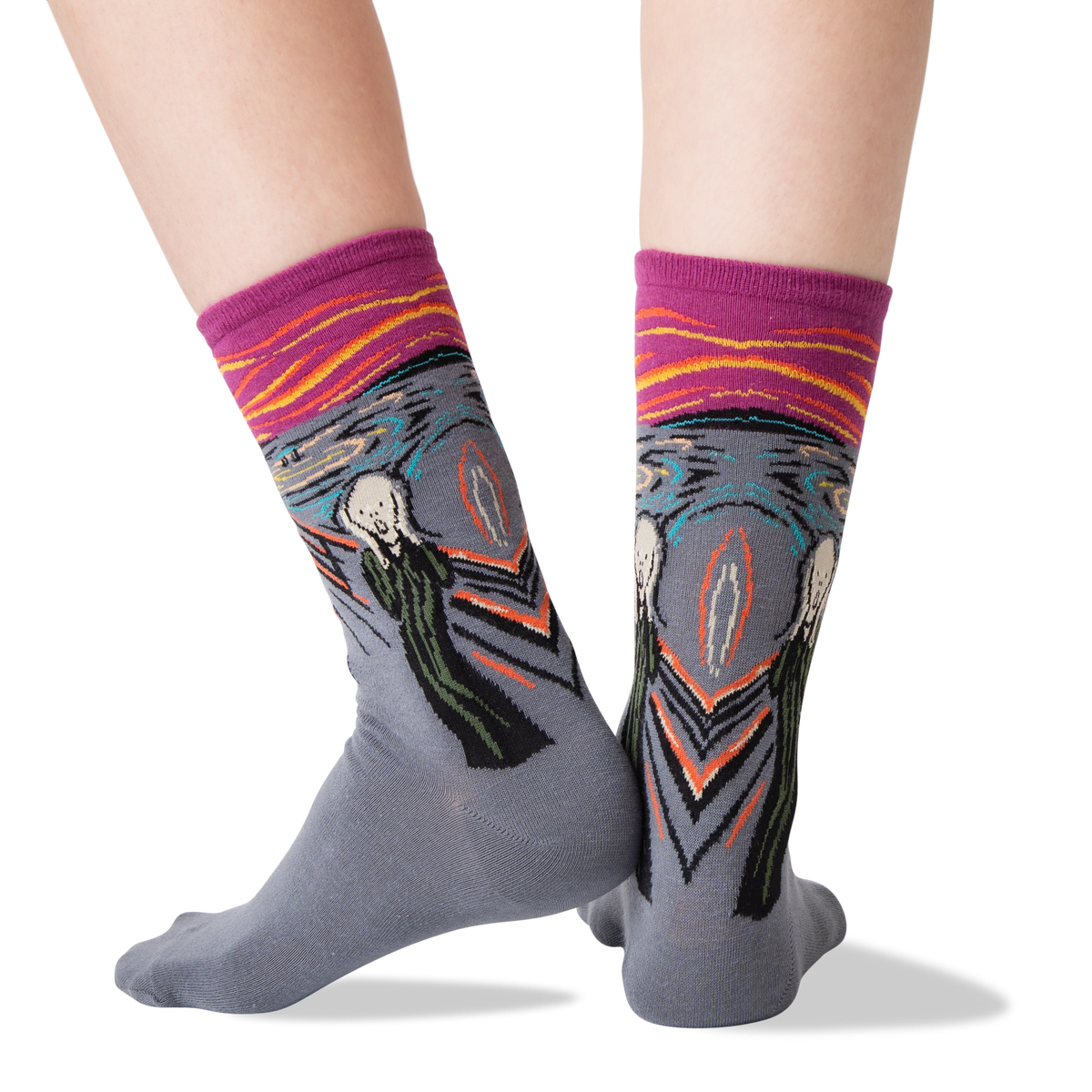 Gray crew socks with a surreal art print featuring Edvard Munch's 'The Scream' and a swirling landscape, with a magenta cuff, shown on a person's feet against a white background.