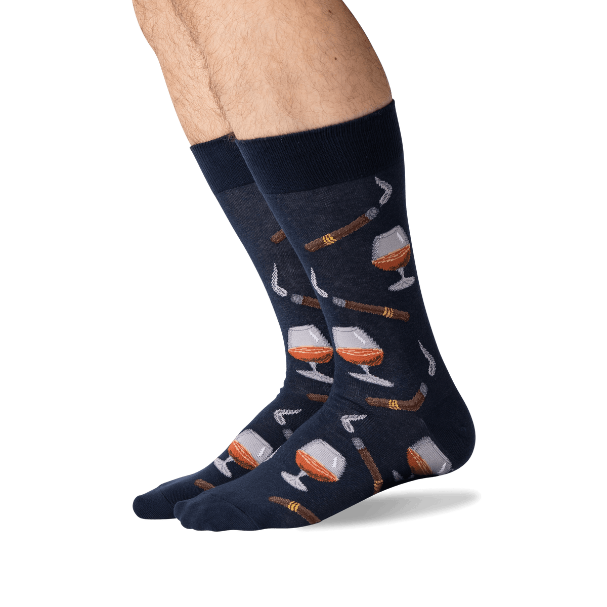 Navy socks with wine glass and bottle pattern worn by a person on a white background