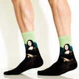 Mona Lisa-themed socks worn by a person on a plain background