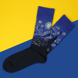 Pair of socks with 'Starry Night' design on a yellow and blue background thumbnail