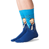 A pair of crew socks worn on a person's feet, featuring a blue background with a printed portrait of Vincent van Gogh in a swirling brushstroke style. The feet are shown against a clean white background.