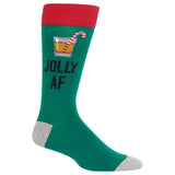 A single crew sock on a plain white background. The sock is dark green with a red cuff, gray heel and toe, and features a graphic of a drink with a candy cane and the text 'JOLLY AF' in black.