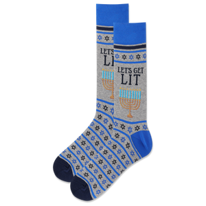 A pair of men's crew socks with blue and gray color scheme, featuring lit candles on the menorah and star of david designs, and the text 'LET'S GET LIT'.