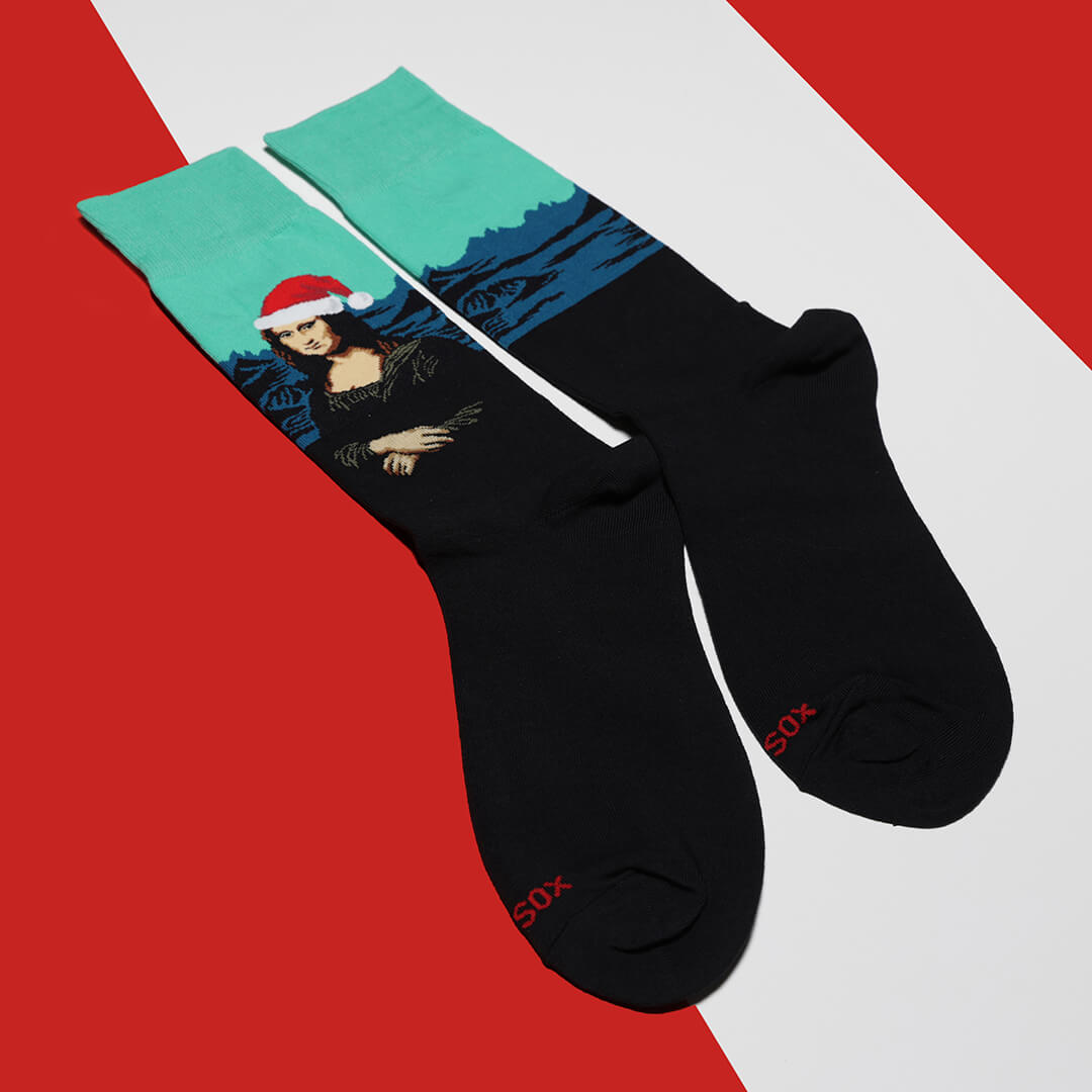 Black socks with a Santa-themed Mona Lisa design on a red and white background