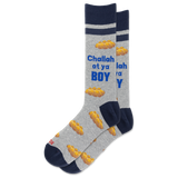 A pair of crew socks in heather gray with navy blue cuffs, heels, and toes, featuring a pattern of golden matzah bread and the text 'Challah at ya BOY' in blue and white.