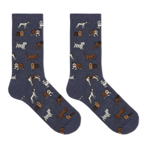 A pair of navy blue crew socks with an all-over print of various dog breeds in brown, white, and tan, displayed flat against a solid white background.