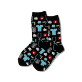 Two people standing in a room wearing medical patterned socks with a chalkboard wall and wooden floor. thumbnail