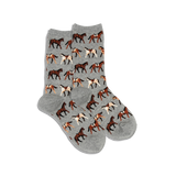 A pair of HOTSOX women's crew socks with a pattern of horses on a gray background.