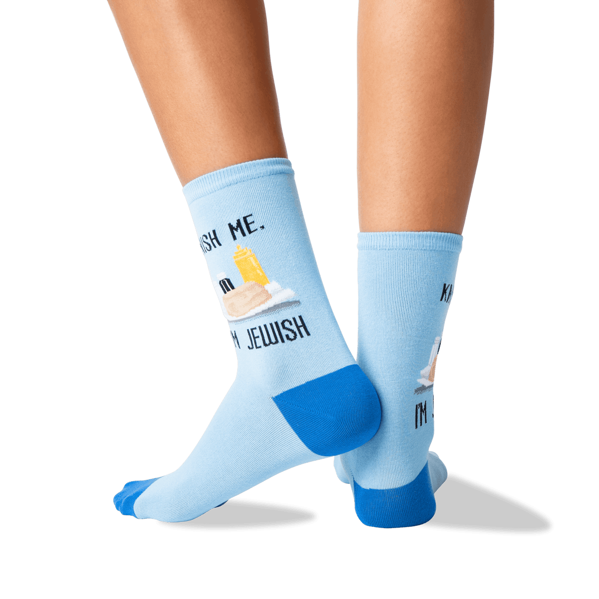 A pair of light blue crew socks with bright blue heels, toes, and cuffs, featuring a graphic text of 'KNISH ME. I'M JEWISH.'