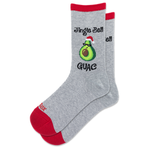 A pair of heather gray crew socks with red toes, heels, and cuffs, featuring a graphic of an avocado wearing a Santa hat with the text 'Jingle Bell GUAC' and 'HOTSOX' on the foot.