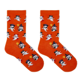 A pair of bright orange crew socks with an all-over Halloween ghost pattern, shown flat against a solid white background.