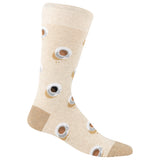A single crew sock in a light beige heathered fabric, decorated with a repeating pattern of coffee cups with steam and small coffee drips. The sock features a solid tan heel and toe, and is shown against a plain white background.