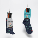 Two pairs of socks hanging on a rack with labels. thumbnail