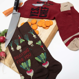 Brown socks with vegetable pattern and red shirt with 'YES CHEF!' text on a white background