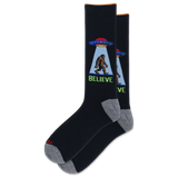 A pair of black crew socks with gray heels and toes, featuring a graphic of a Bigfoot silhouette under a UFO with the word 'BELIEVE' in green. thumbnail