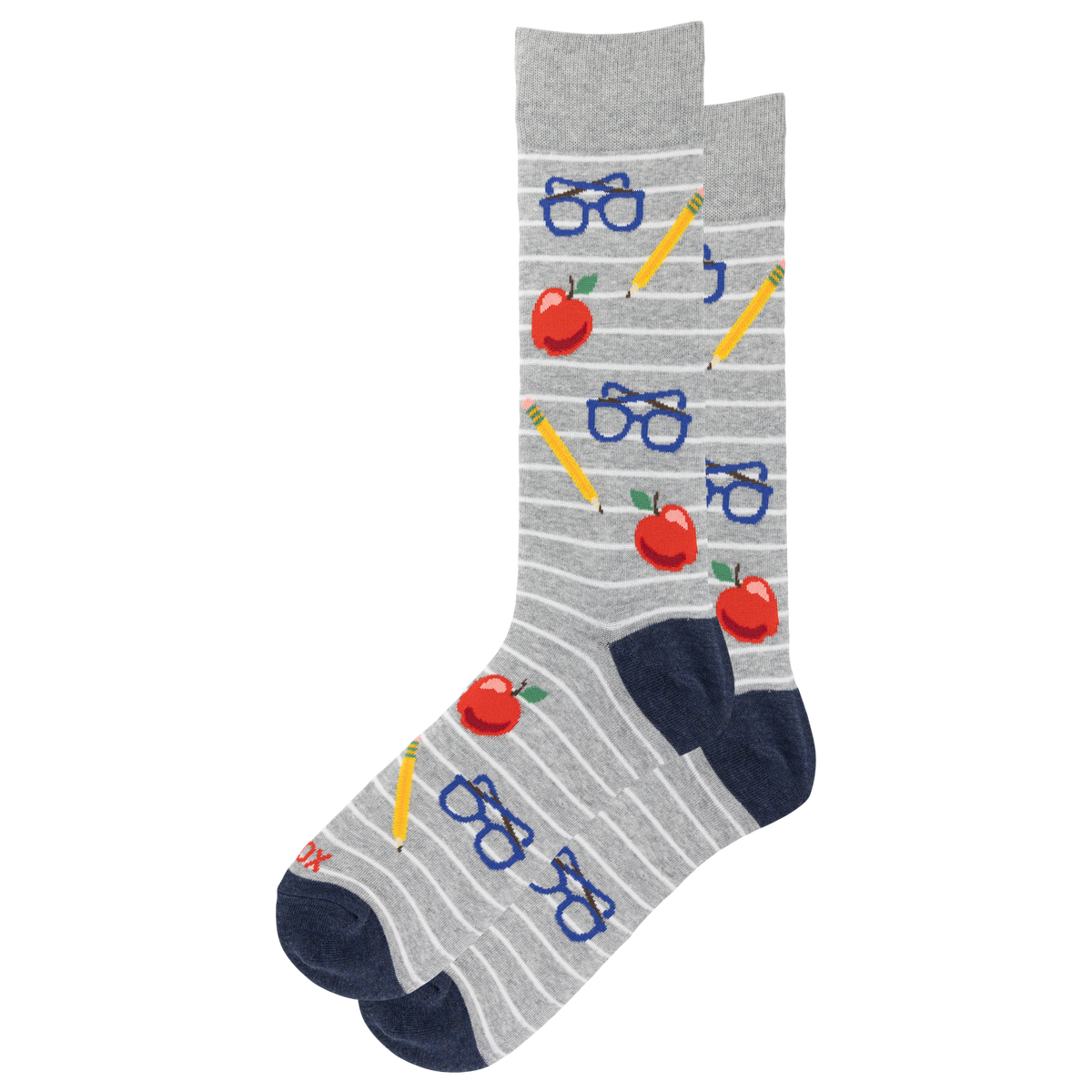 A pair of gray crew socks with thin white horizontal stripes, featuring a playful school-themed pattern of red apples, blue glasses, yellow pencils, and navy blue heels and toes.