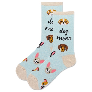 A pair of light blue crew socks with a 'dog mom' theme, featuring cartoon dog faces, and black script text saying 'dog mom,' shown on a plain white background.