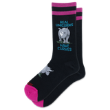A pair of black crew socks with pink and magenta stripes at the top, featuring a gray rhinoceros graphic and the text 'REAL UNICORNS HAVE CURVES' in blue. The toes and heels are bright pink, and the brand name 'HOTSOX' is visible near the foot.
