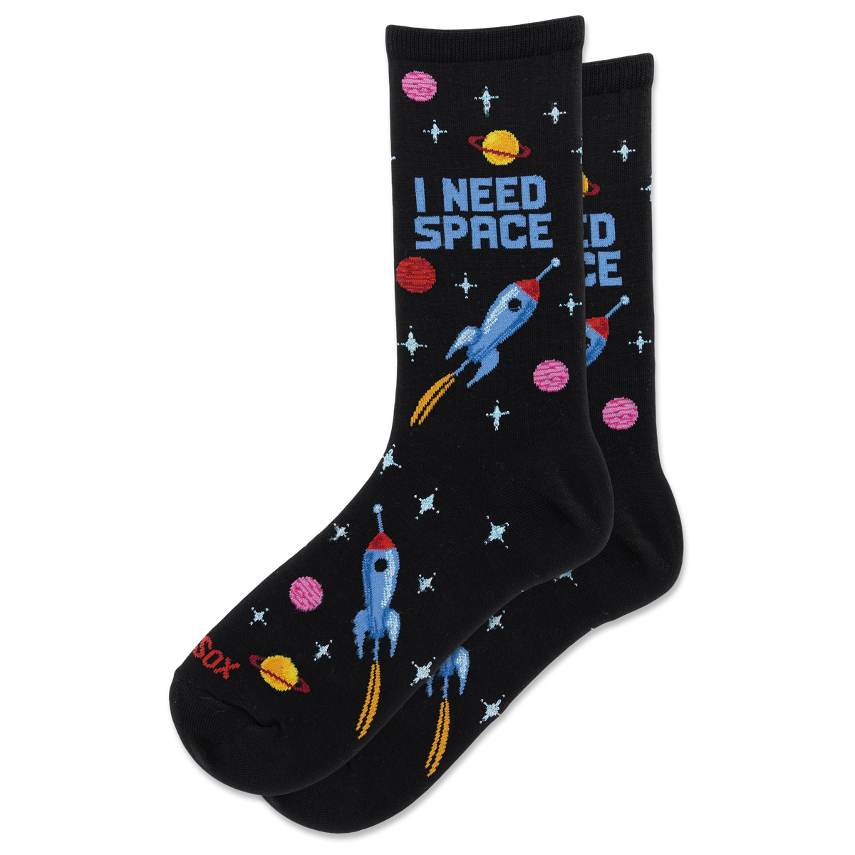 A pair of black crew socks with a colorful space-themed pattern featuring blue rockets, pink and yellow planets, and the text 'I NEED SPACE' on a white background.
