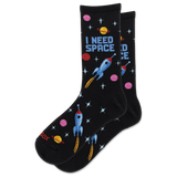 A pair of black crew socks with a colorful space-themed pattern featuring blue rockets, pink and yellow planets, and the text 'I NEED SPACE' on a white background. thumbnail