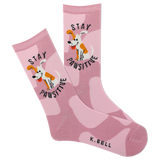 A pair of pink crew socks with a camouflage pattern and a cartoon depiction of a dog. The text 'stay pawsitive' is also featured on the socks. thumbnail