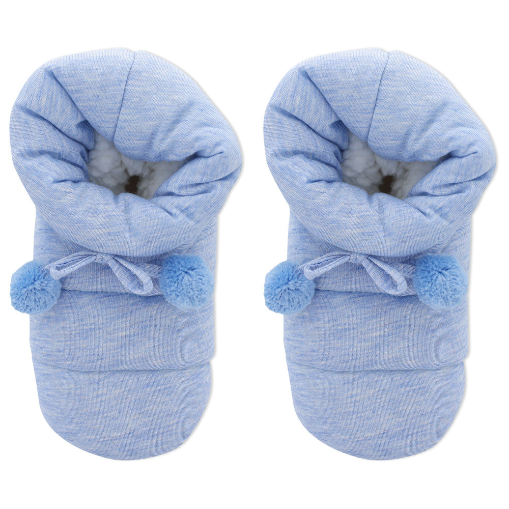 Pair of blue baby booties with pom-poms on a white background