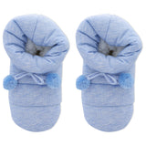 Pair of blue baby booties with pom-poms on a white background
