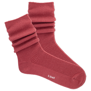 Red ribbed women's slouch sock on a white background