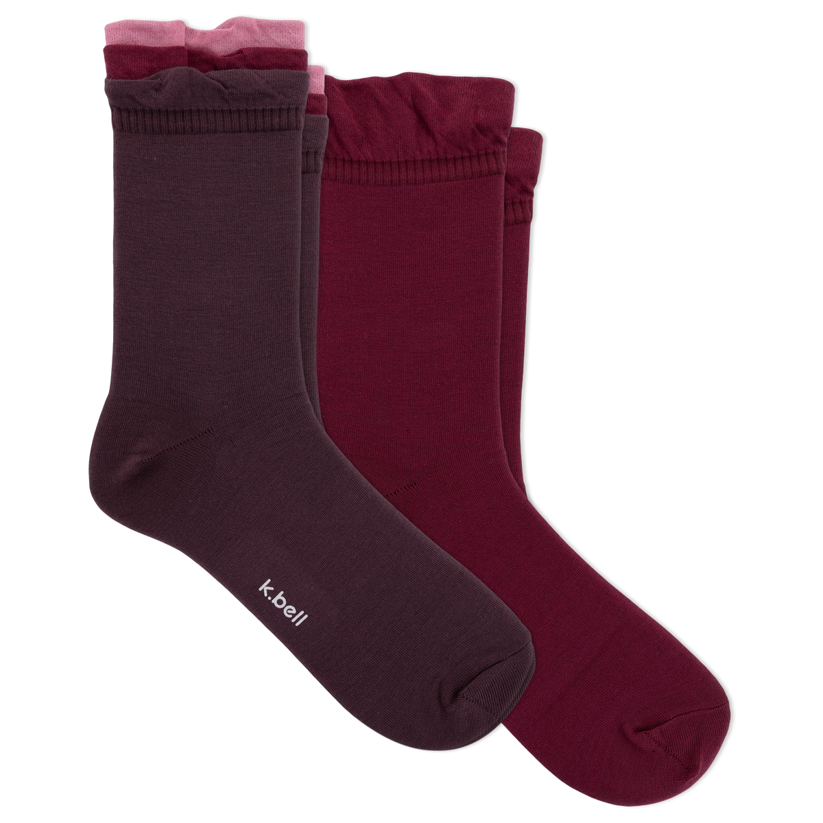 Three pairs of women's crew socks in dark plum, burgundy, and dusty rose, arranged overlapping on a plain white background. The brand name 'kbell' is printed in white on the toe of the front sock.