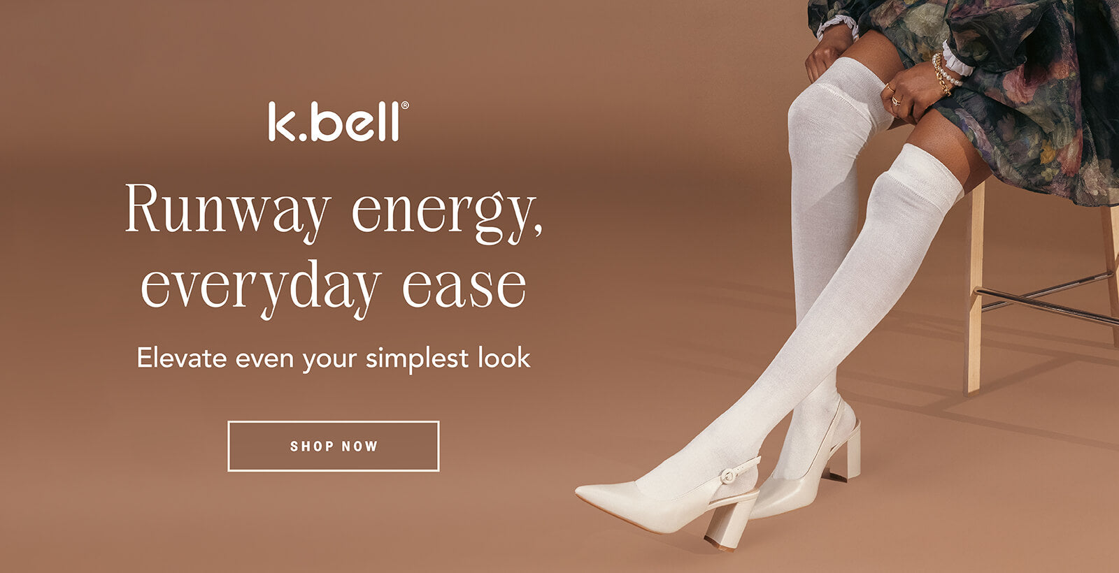 K. Bell advertisement with a person wearing white over-the-knee socks on a brown background.