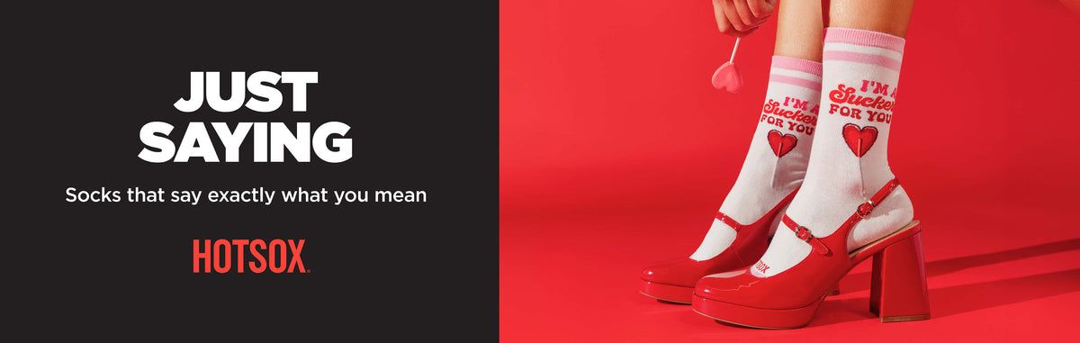 A promotional banner for HOTSOX socks. The left side has a dark gray background with white and orange text reading 'JUST SAYING' and 'Socks that say exactly what you mean HOTSOX'.