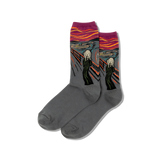 Gray socks with 'The Scream' colorful design on a blackboard easel with art supplies.
