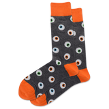 A pair of men's crew socks with a pattern of glowing eyeballs on a dark background and orange trim.