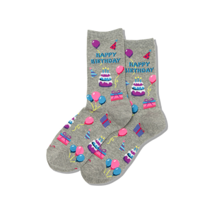 Gray socks with birthday-themed designs on a white background