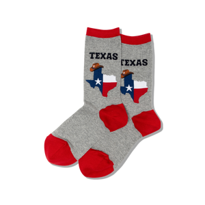 A pair of gray crew socks with red heel and toe, featuring the text 'TEXAS' and the shape of the state of Texas, along with a cowboy hat design.