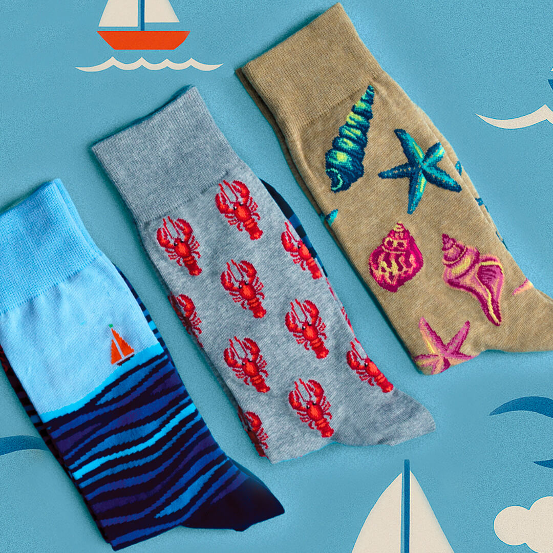 Assorted men's nautical-themed novelty HOTSOX crew socks.