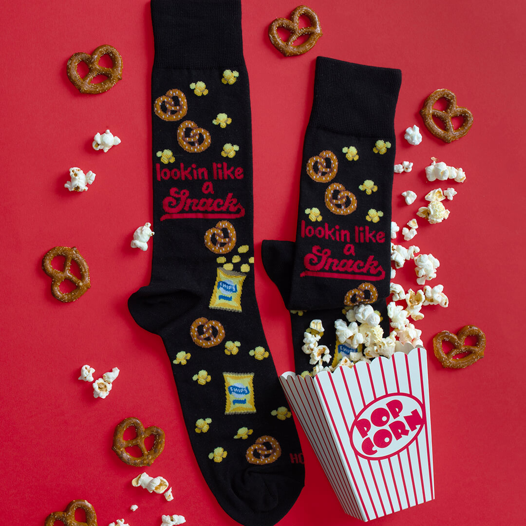 HOTSOX men's novelty crew socks in black with popcorn, pretzels and the words, "Lookin' like a snack'