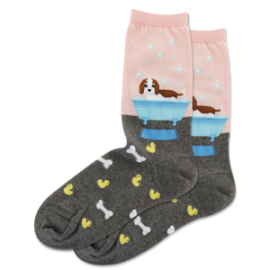 A pair of women's crew socks with dog-themed designs on a white background
