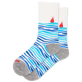 Socks with blue wavy pattern and red sailboats on a white background