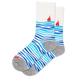 Socks with blue wavy pattern and red sailboats on a white background