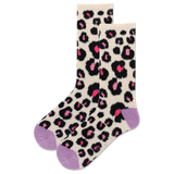 Leopard print socks with pink accents on a beige background